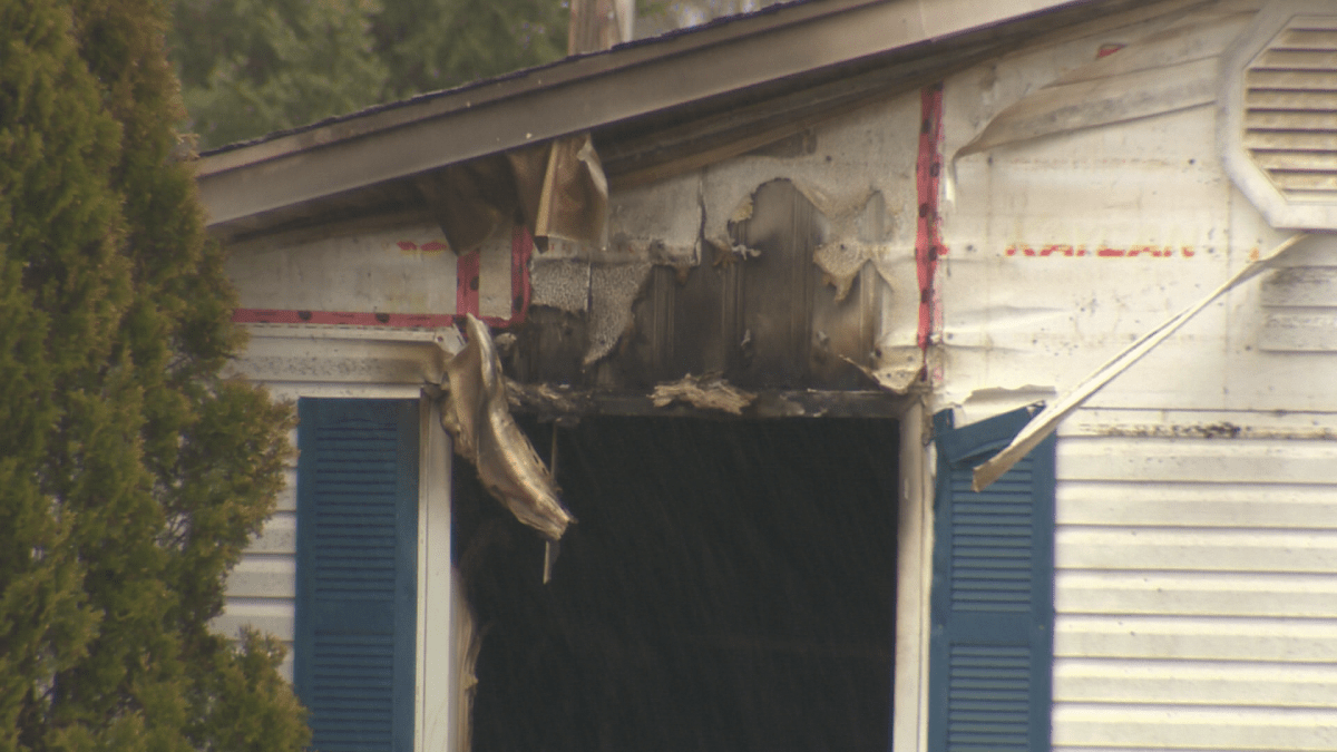 Mounties say the home was engulfed in flames when they arrived on scene.