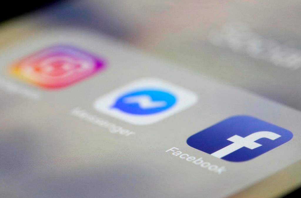 FILE- In this March 13, 2019, file photo Facebook, Messenger and Instagram apps are are displayed on an iPhone in New York.