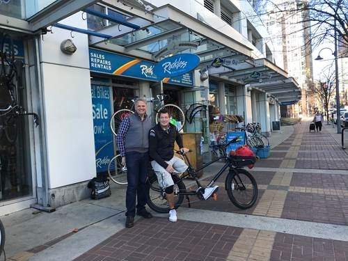 Reckless Bikes owner Paul Dragan, left, stands next to Me and My Mirror founder Stephen Sumner with his new cargo bike.