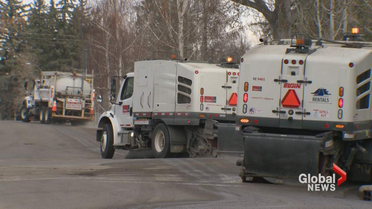 Street sweepers are seen cleaning a Calgary street.