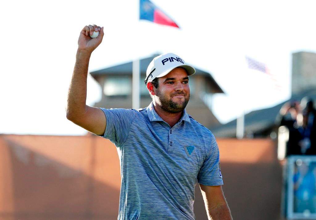 Corey Conners celebrates after sinking a putt on the 18th hole to win the Texas Open golf tournament, Sunday, April 7, 2019, in San Antonio.