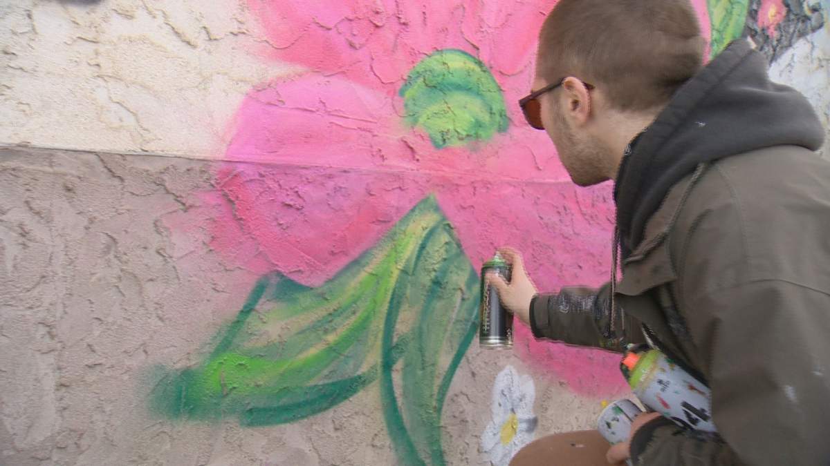 Jez, of Akme Murals, is finishing up the mural he started in the fall at the Ukrainian Co-op in Regina.