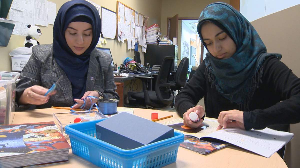 Aseel Mohammed Ali 
ISANS volunteer program coordinator and volunteer Ouroba Al-Ahmad translate some children's books into Arabic to help preschoolers learn English.  