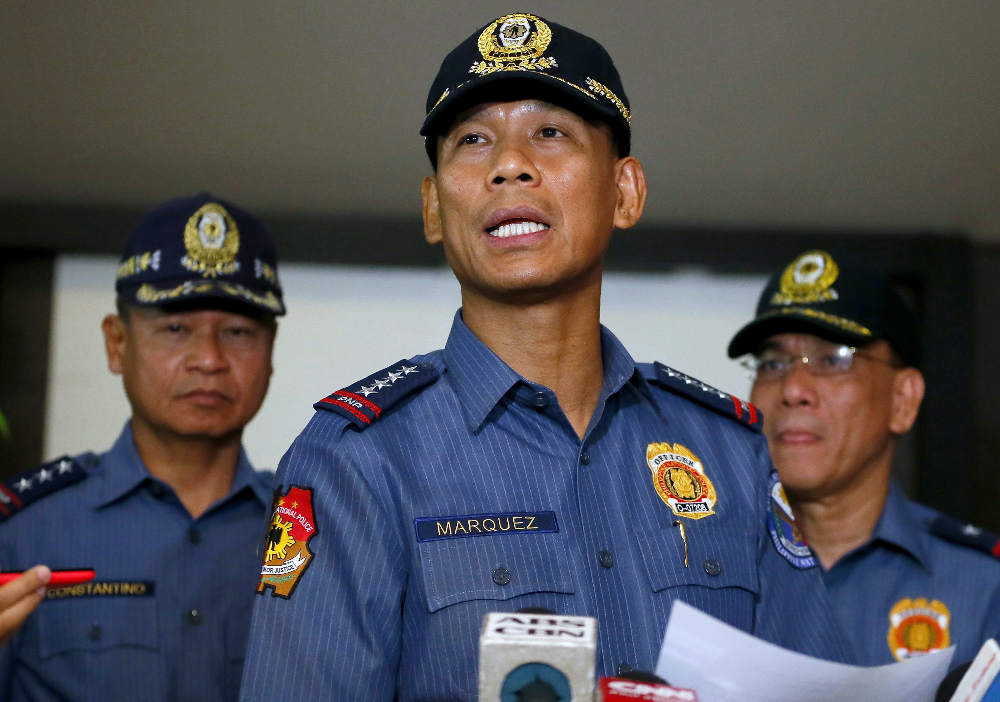 Philippine National Police Director Gen. Ricardo Marquez reads a statement on the execution of Canadian hostage John Ridsdel by Abu Sayyaf militants on April 26, 2016, Quezon city, Philippines. (AP Photo/Bullit Marquez)