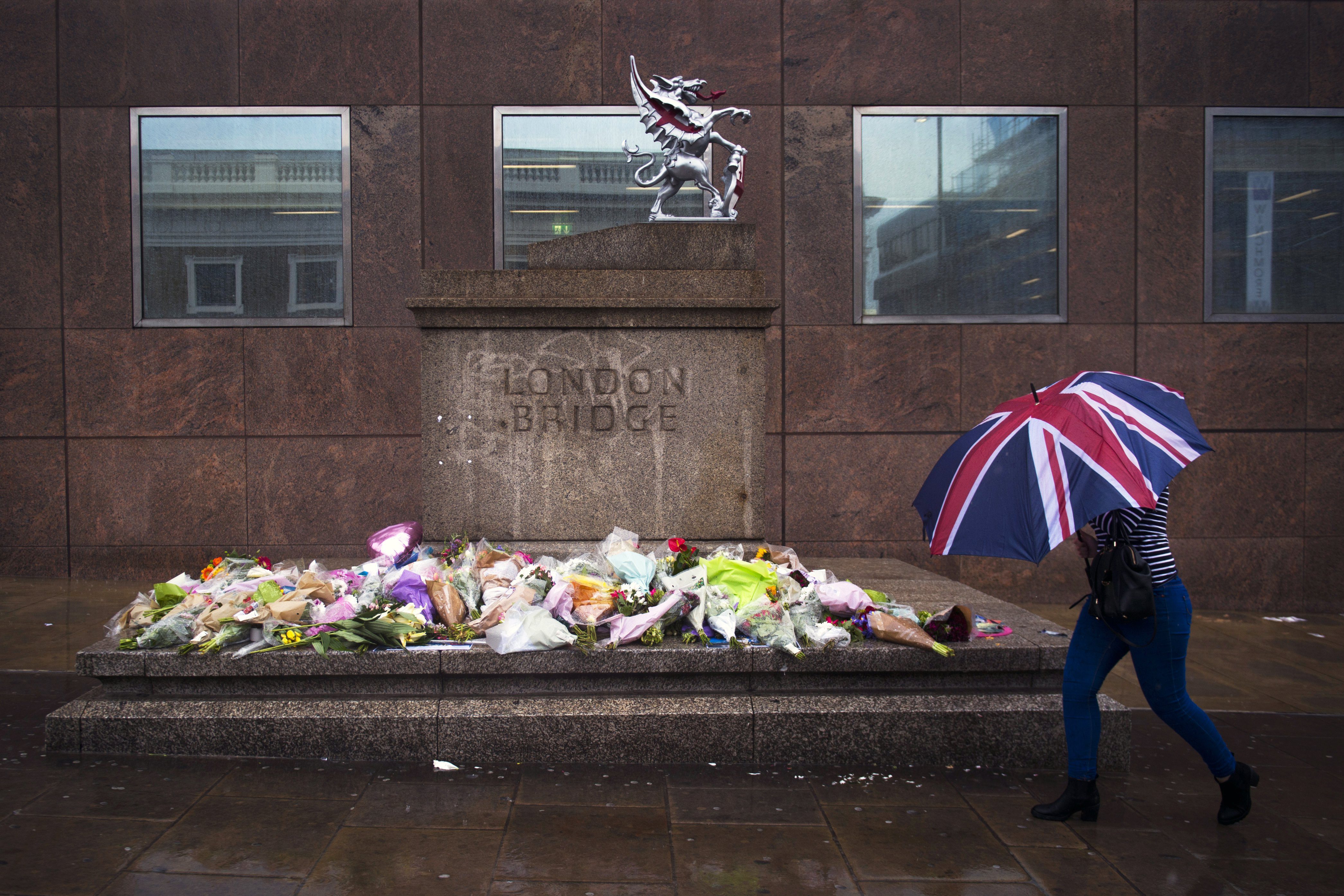 Flowers and tributes left for victims of the London Bridge terror attacks. Canadian Christine Archibald was among those killed in the June 3, 2017 attack by ISIS supporters. EPA/WILL OLIVER