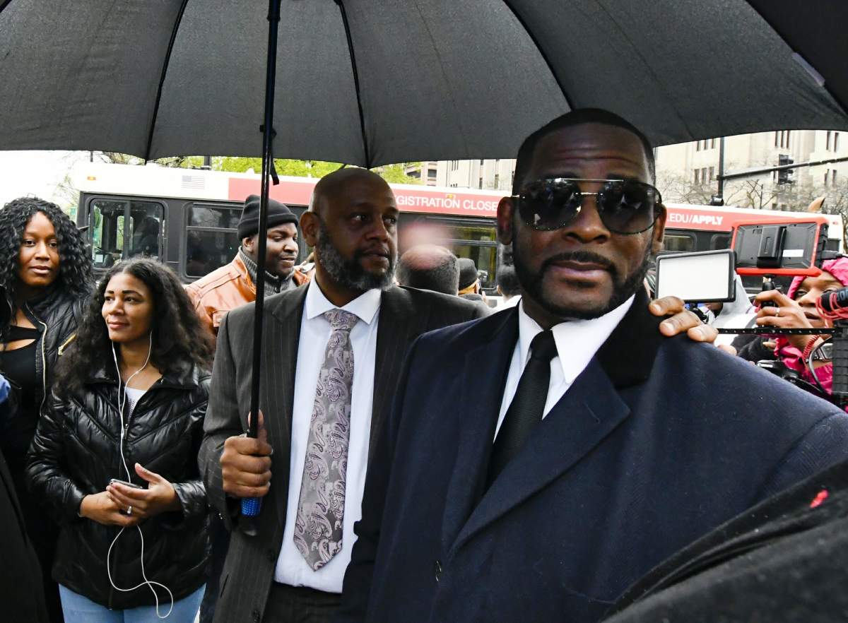 Musician R. Kelly, right, leaves the Leighton Criminal Court building after a hearing in his sex-abuse case, Tuesday, May 7, 2019, in Chicago.