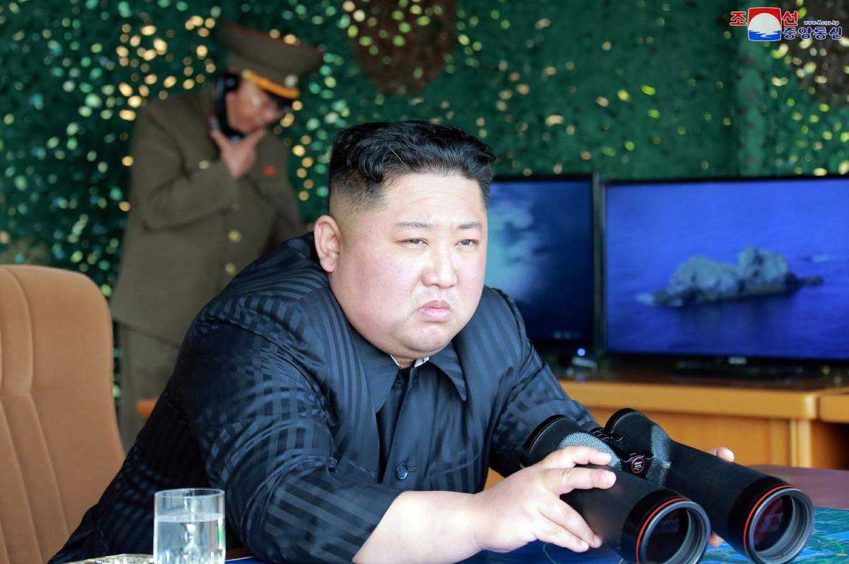 This Saturday, May 4, 2019, photo provided on Sunday, May 5, 2019, by the North Korean government shows North Korean leader Kim Jong Un, equipped with binoculars, observing tests of different weapons systems, in North Korea.