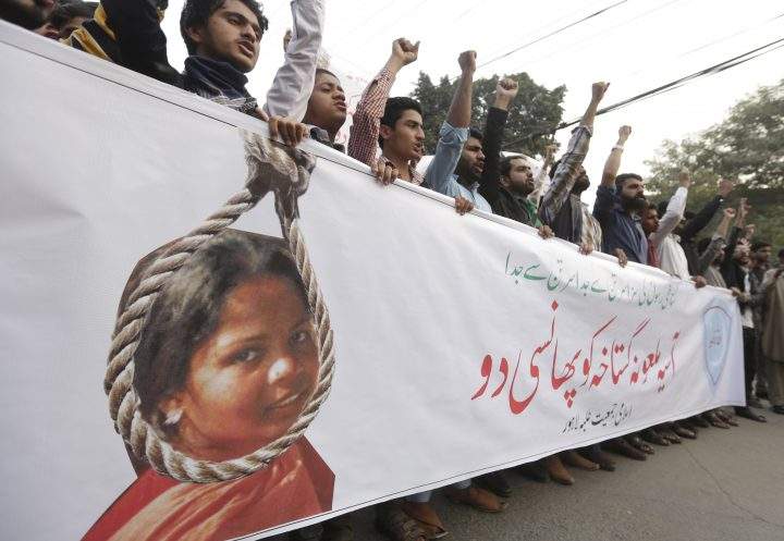 People shout slogans as they protest the release of Asia Bibi, a Christian accused of blasphemy, whose death sentence was annulled by the Supreme court, in Lahore, Pakistan, November 2018.