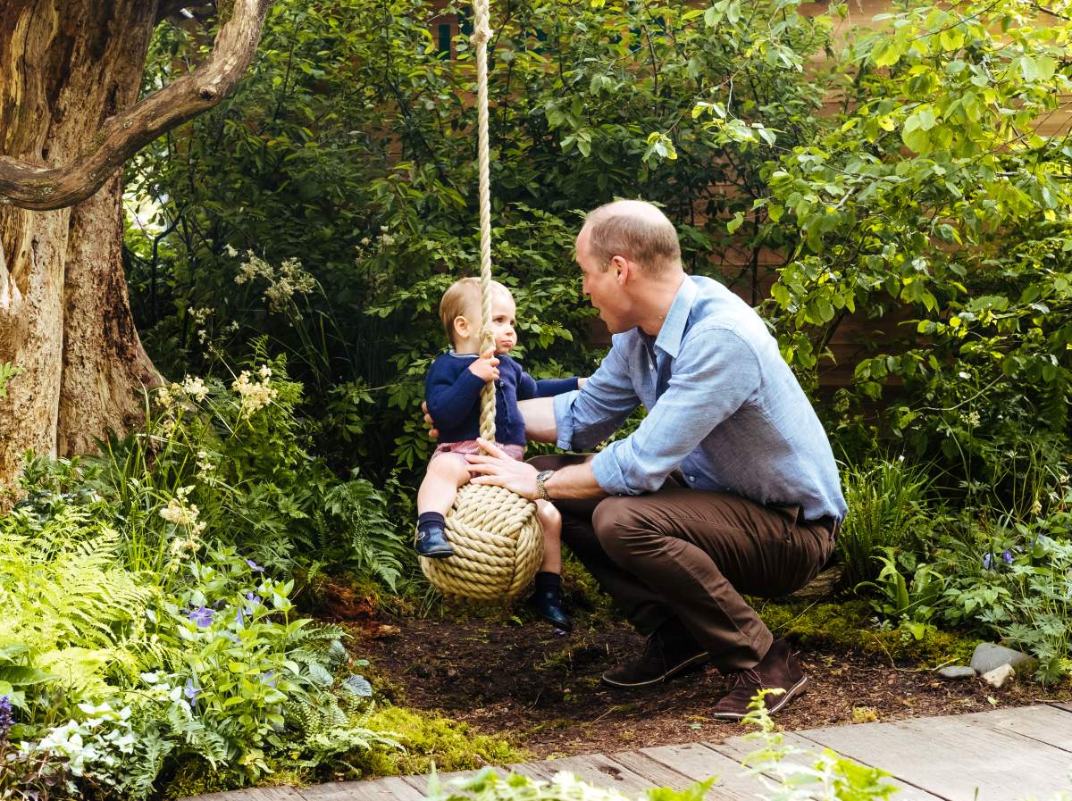Britain’s Prince William plays with Prince Louis at the Adam White and Andree Davies co-designed garden ahead of the RHS Chelsea Flower Show in London, Britain. May 19, 2019. Picture taken May 19, 2019. Matt Porteous/PA Wire/Handout via REUTERS
