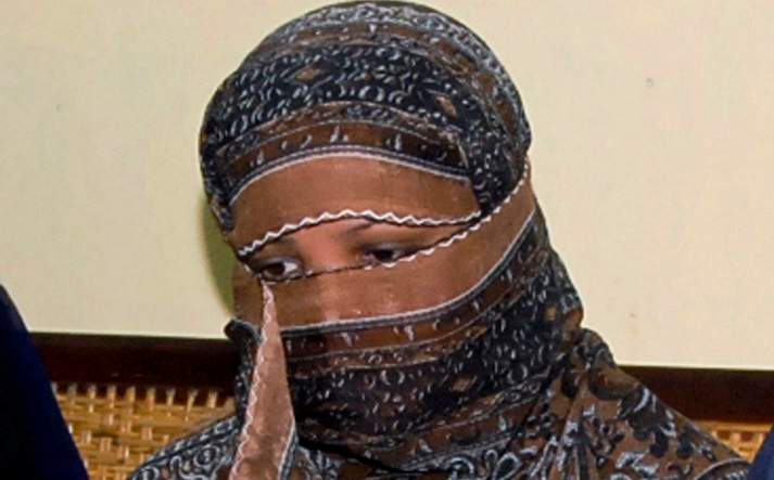 In this Nov. 20, 2010, file photo, Asia Bibi, a Pakistani Christian woman, listens to officials at a prison in Sheikhupura near Lahore, Pakistan.