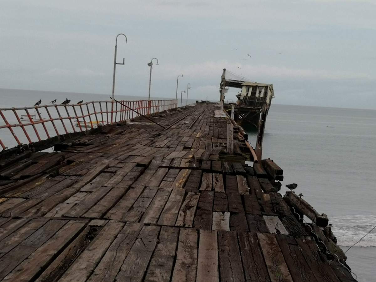 An office structure at the end of an abandoned pier, a local landmark, inclines to the right after an earthquake in Puerto Armuelles, Panama, Sunday, May 12, 2019.