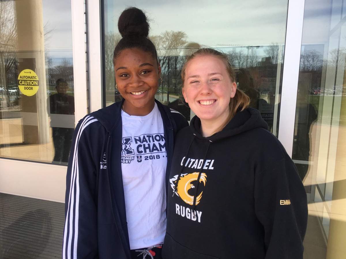 Emma MacDougall and Tashayla Tyne, players on the Citadel High School rugby team, pose for a photo on May 7, 2019.