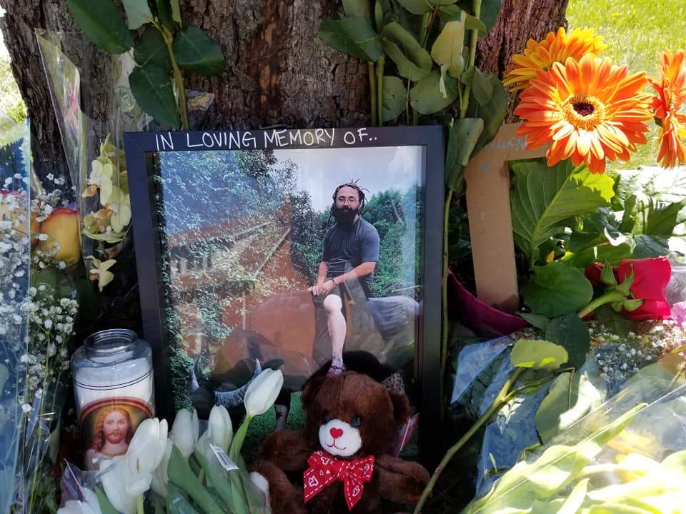 A memorial for Adam Umbelina is seen Wednesday at the scene of the May 7, 2019 collision that claimed his life on Clarke Road near Dundas Street.