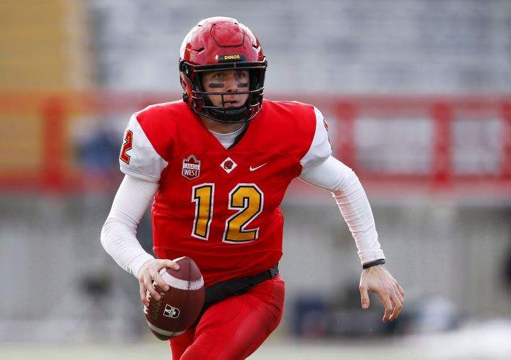 University of Calgary Dinos' quarterback Adam Sinagra looks to pass the ball against the University of Saskatchewan Huskies during first half Hardy Cup CWUAA championship football action in Calgary, Saturday, Nov. 10, 2018. 