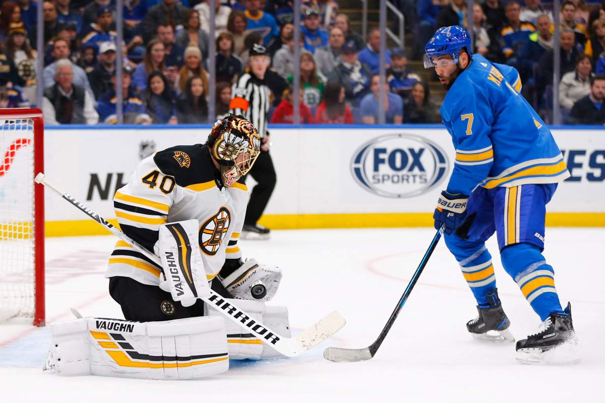 Boston Bruins goalie Tuukka Rask, left, makes a save against St. Louis Blues' Patrick Maroon during a game on Feb. 23, 2019, in St. Louis.