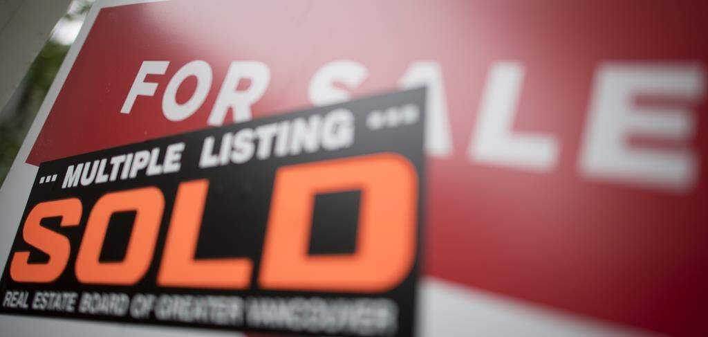 A real estate sign is pictured in Vancouver, B.C., Tuesday, June, 12, 2018.