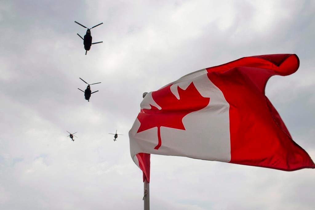 Canadian Forces CH-47 Chinooks participate in a flyover of Parliament Hill in Ottawa on Friday, May 9, 2014.