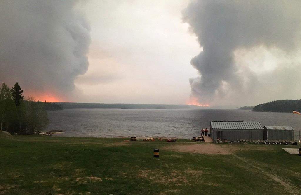 Fires burn in Little Grand Rapids, Man., as shown in a 2018 Government of Manitoba handout photo. THE CANADIAN PRESS/HO - Government of Manitoba.