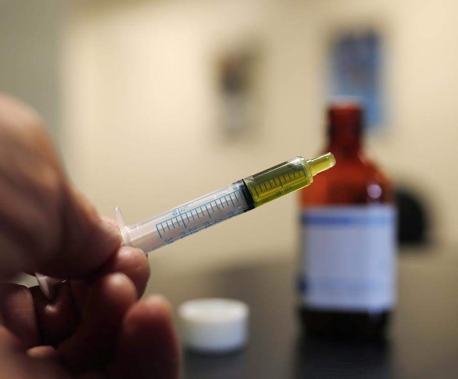 A syringe loaded with a dose of CBD oil.