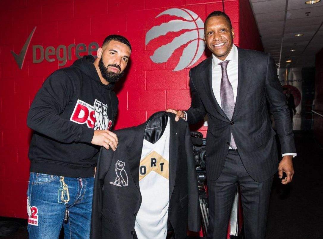 Raptors president Masai Ujiri gives Drake a diamond-crusted jacket on Tuesday night before Game Four between the Raptors and the Bucks.