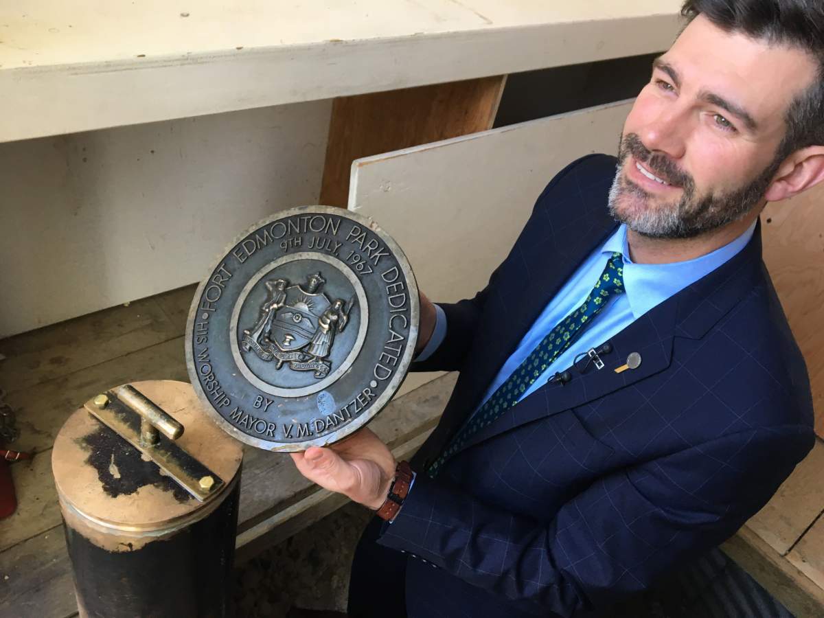 Mayor Don Iveson displaying the cover of the time 1967 centennial capsule buried Fort Edmonton Park on Wednesday, May 22, 2019. 