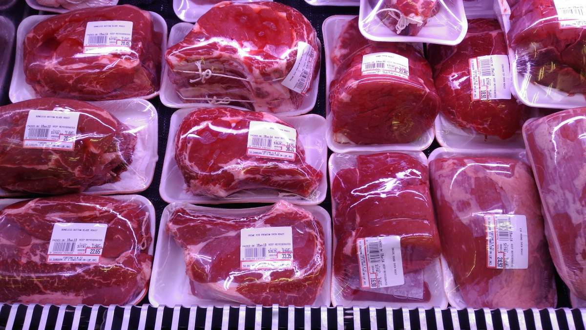 Hamilton police say a man tried to walk out of a grocery store on Monday afternoon without paying for high-end meat.