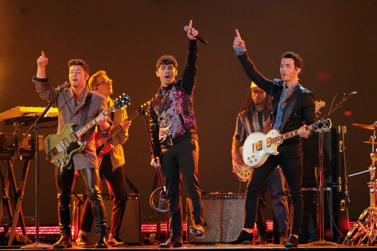 Pictured: (left to right) Nick Jonas, Joe Jonas and Kevin Jonas of the Jonas Brothers. (Chris Haston/NBC/NBCU Photo Bank via Getty Images)