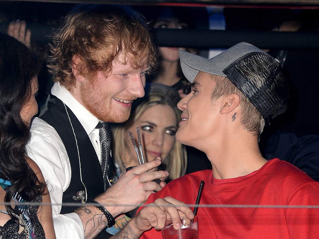 Justin Bieber (R) watches the show with Ed Sheeran from the Glamour pit during the MTV EMA’s 2015 at the Mediolanum Forum on Oct. 25, 2015, in Milan, Italy.
