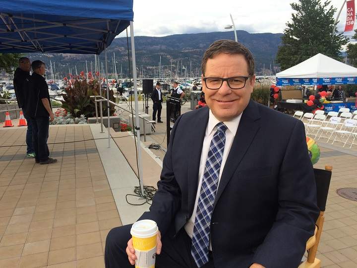 Rick Webber posing for a photo prior to a live, outdoor news broadcast along Kelowna’s waterfront.