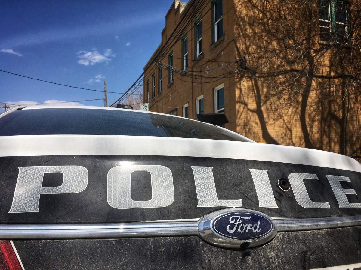 A Winnipeg police cruiser outside an apartment block.