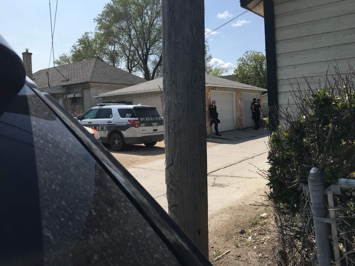 Police at the scene near Watt Street and Nairn Avenue.