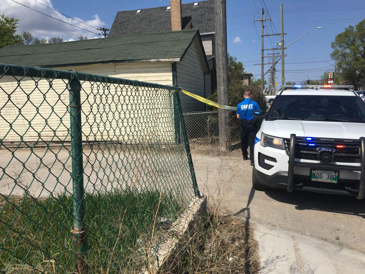 Officers tape off a back lane near Nairn Avenue and Watt Street.