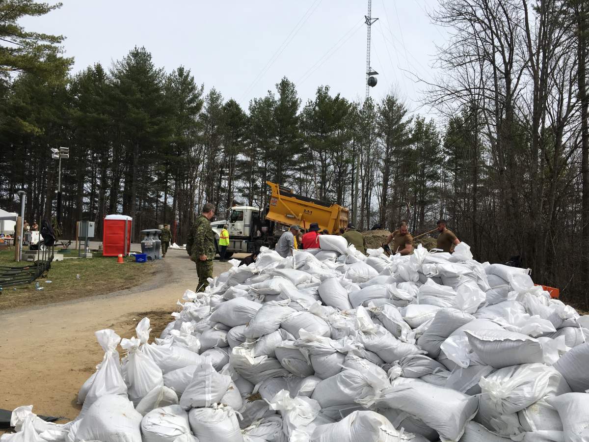 As the Ottawa River spills over into Constance Bay and Fitzroy Harbour, volunteers and Canadian military members fill sandbags at Fitzroy Provincial Park on Monday, April 29, 2019. 