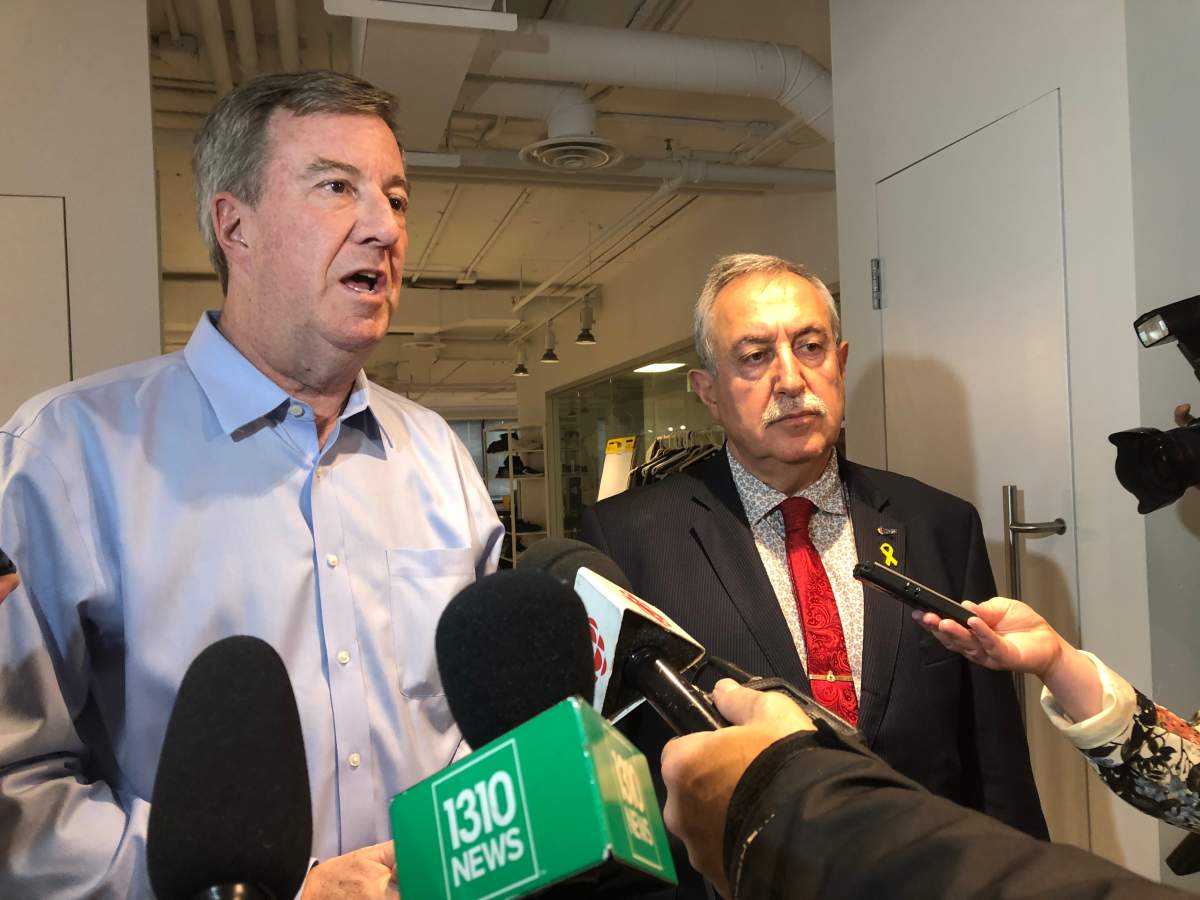 Ottawa Mayor Jim Watson and West Carleton-March Coun. Eli El-Chantiry talk to reporters about what was discussed during a closed-door meeting with the provincial flooding task force on Friday.