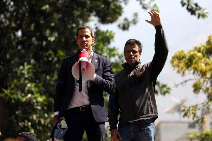 Venezuelan National Assembly president Juan Guiado, left, and opposition leader Leopoldo Lopez speak during a protest in Caracas, Venezuela, on April 30, 2019.