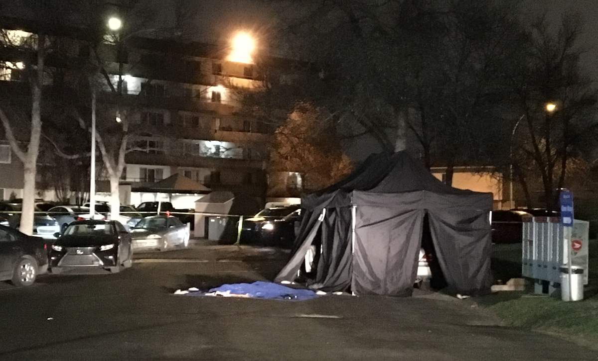 Police tape blocking off the parking lot of the Lord Byron Towers complex just south of Whitemud Drive on 122/119 Street, in south Edmonton’s Royal Gardens neighbourhood. Tuesday, May 7, 2019.