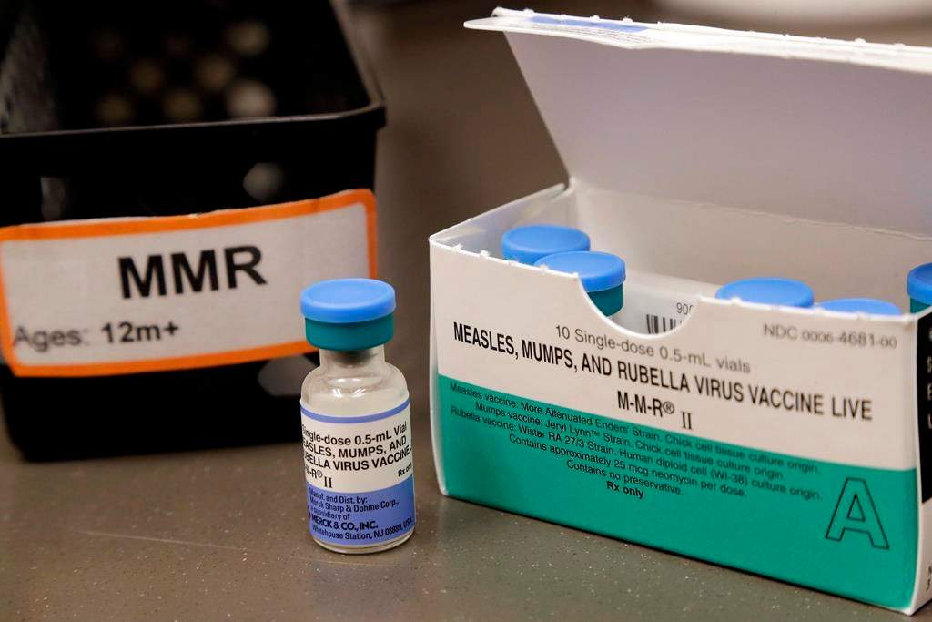 FILE - This May 15, 2019 file photo shows a vial of a measles, mumps and rubella vaccine at a clinic in Vashon Island, Wash. On Thursday, May 30, 2019,.