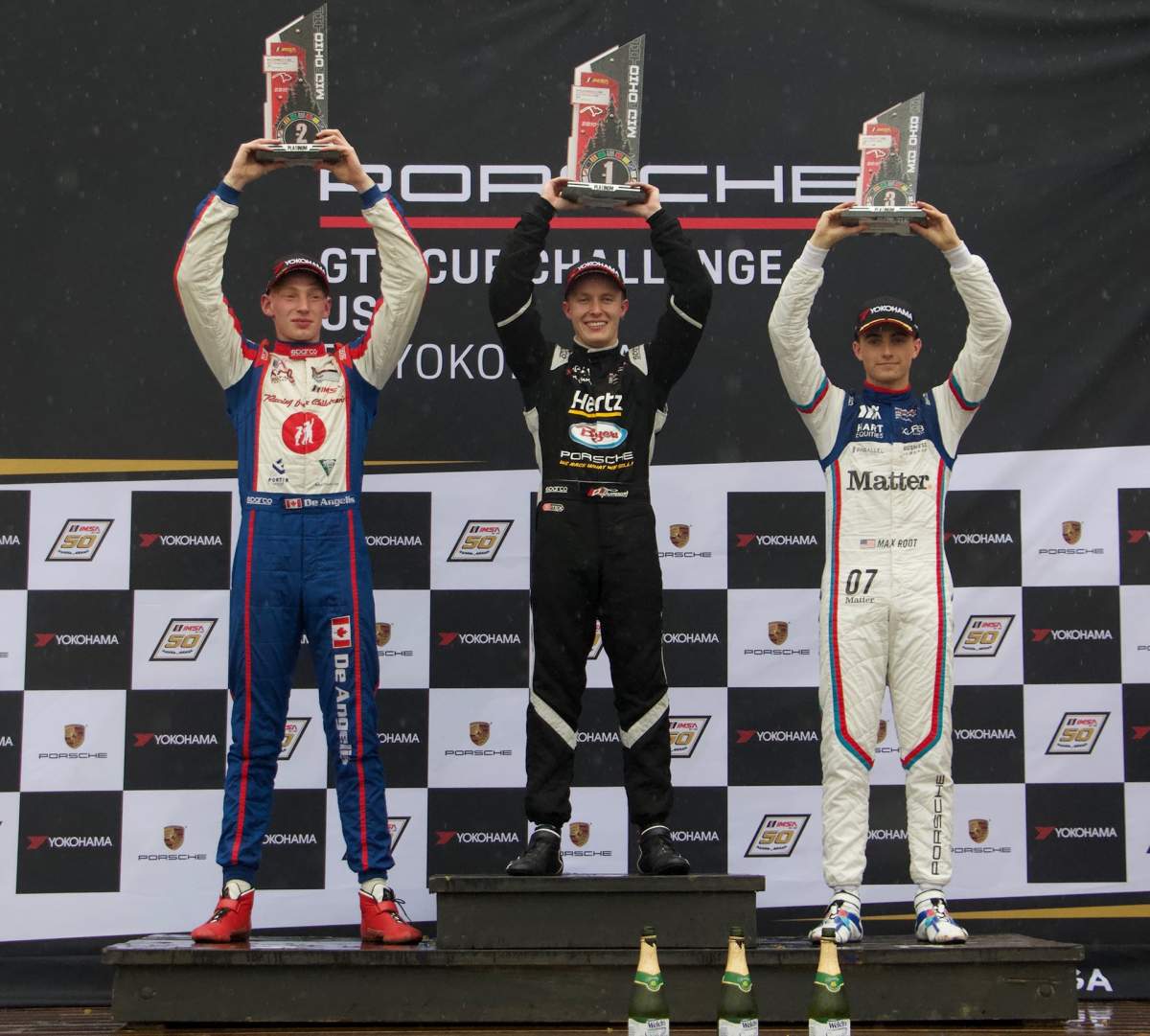 Red Deer’s Parker Thompson (middle) celebrates after winning Race 3 of the Porsche GT3 Cup Challenge USA at Mid-Ohio. The victory was Thompson’s first in a sports car.