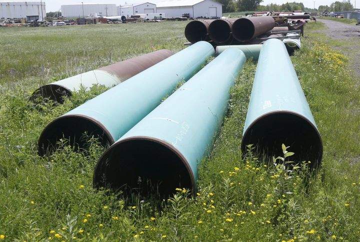 In this June 29, 2018 file photo, pipeline used to carry crude oil is shown at the Superior terminal of Enbridge Energy in Superior, Wisc.