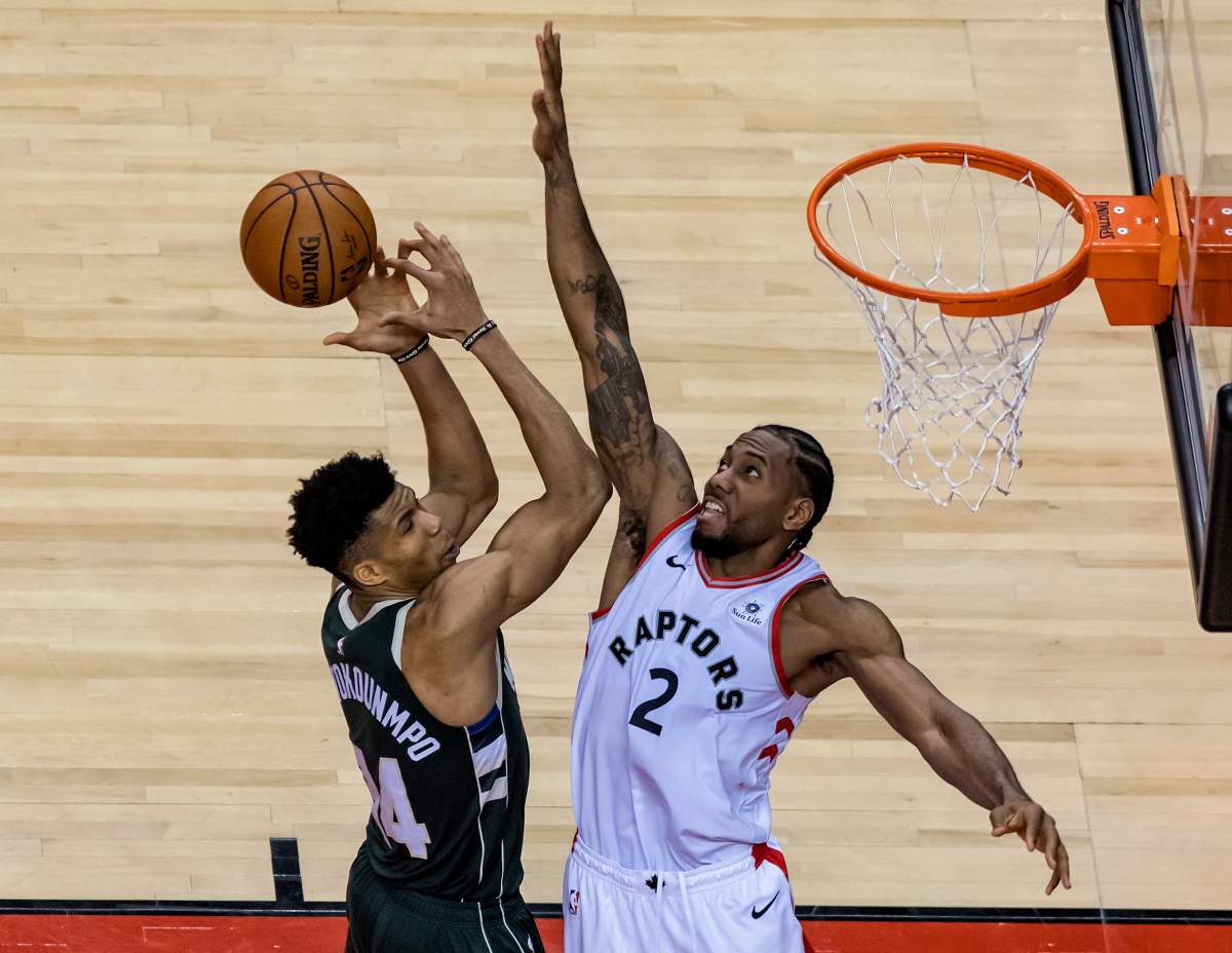 Milwaukee Bucks forward Giannis Antetokounmpo (left) is stopped at the basket by Toronto Raptors forward Kawhi Leonard in the first overtime period of Game 3 of the NBA’s Eastern Conference Final at Scotiabank Arena in Toronto, Canada, 19 May 2019.