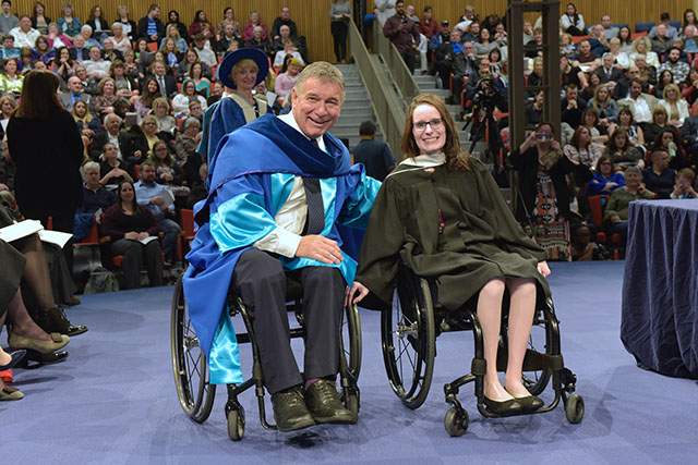 Valedictorian Casey Perrin (right) seen with former Canadian Paralympic athlete and activist Rick Hansen (left).