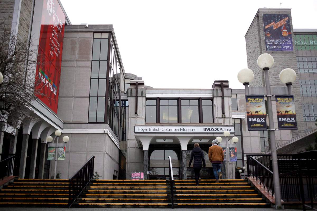 People walk up stairs to the entrance of the Royal BC Museum in Victoria, B.C., on Thursday, December 21, 2017.