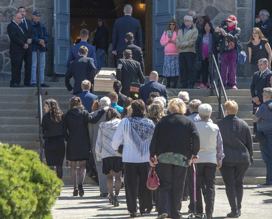 The casket of a seven-year-old girl who was found in critical condition inside of a home and later died is carried to the church for funeral services, Thursday, May 9, 2019 in Granby, Que.