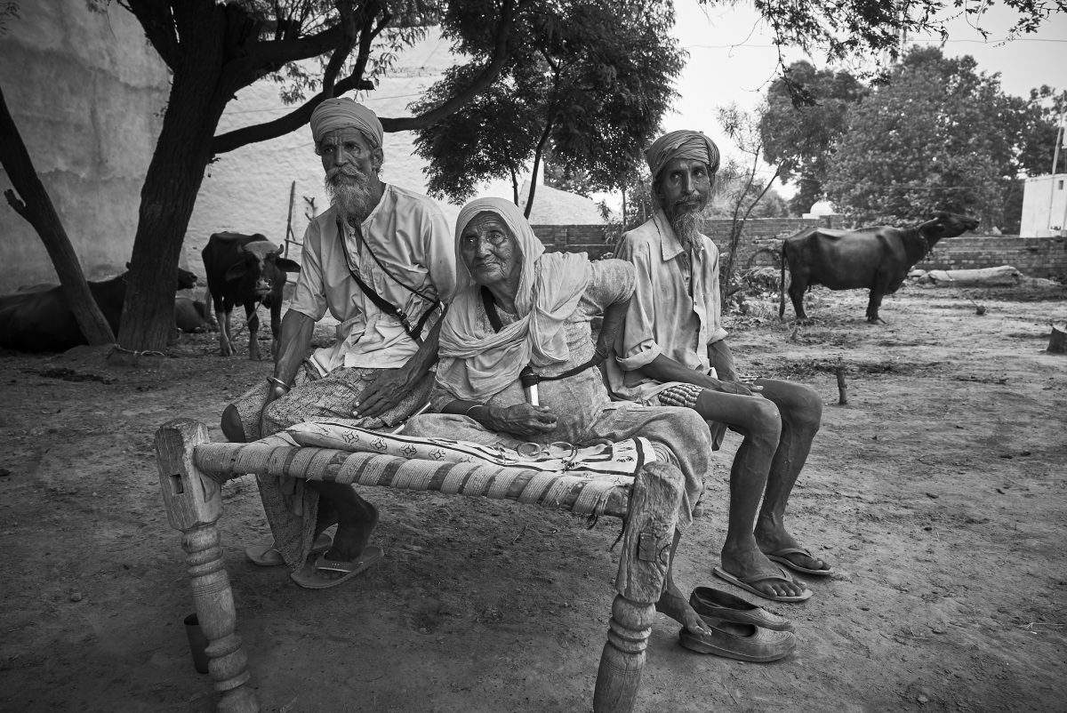 Sawaran Kaur (centre) is shown with family members in Punjab in a handout photo, part of a new exhibit premiering in Vancouver. Her son Mohinder Singh disappeared at age of 22. The international premiere of a photo exhibit featuring Sikh families in Punjab. They were left to mourn the disappearance/death of their loved ones — sons, husbands, brothers — who were among thousands of young men abducted from Punjab during the 1980s and \’90s as the minority Sikhs tried to create a separate homeland called Khalistan.