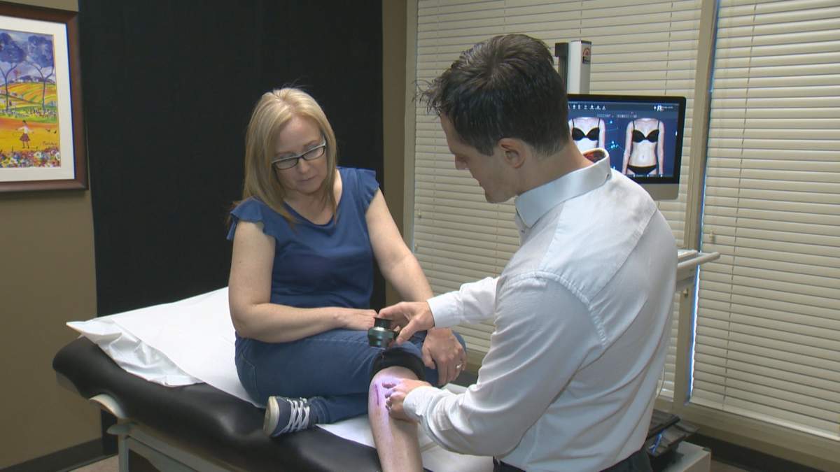 Kimberly Fogarty, left, and Dr. Ben Wiese discuss skin care. May is Skin Cancer Awareness Month.