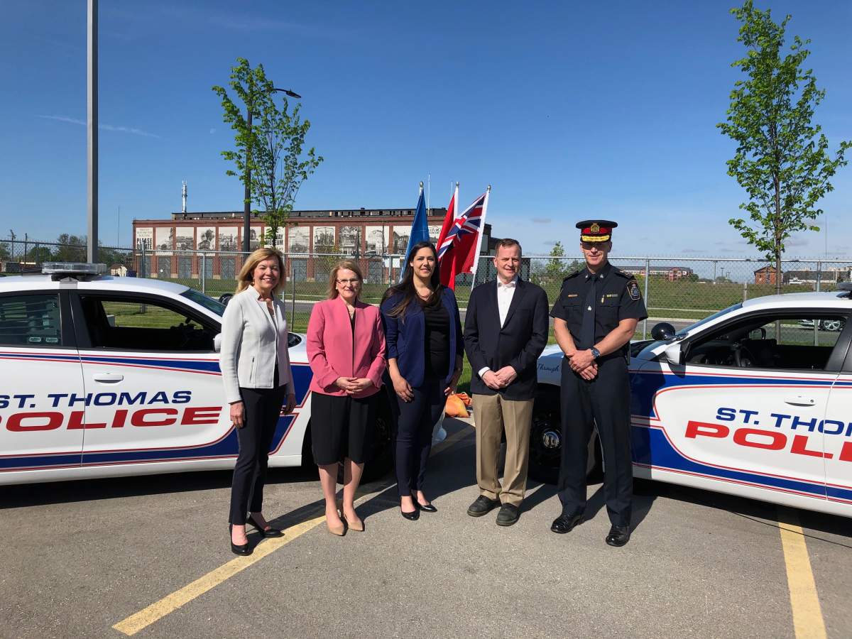 Deputy Premier Christine Elliott, left, Solicitor General Sylvia Jones, second from left, Transportation Minister Jeff Yurek, second from right, and St. Thomas police Chief Chris Herridge, right.