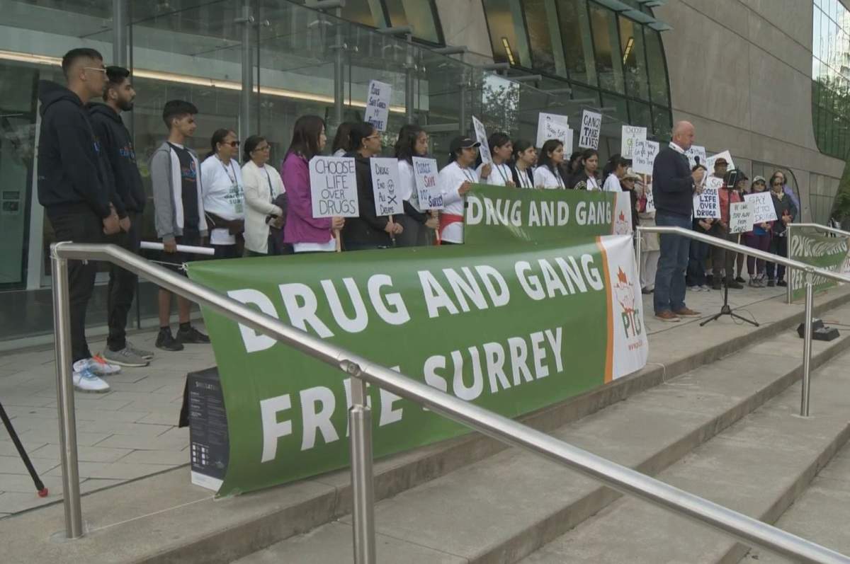 Public Safety Minister Mike Farnworth speaks at the Walk for a Drug and Gang Free Surrey protest on the steps of Surrey City Hall on Saturday, May 18, 2019.
