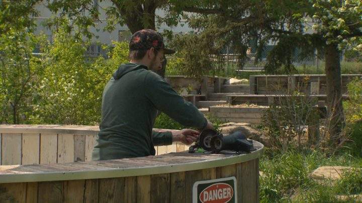 Calgary artist Lane Shordee works on his piece “Water Spiral” at the Wildwood Community Association.