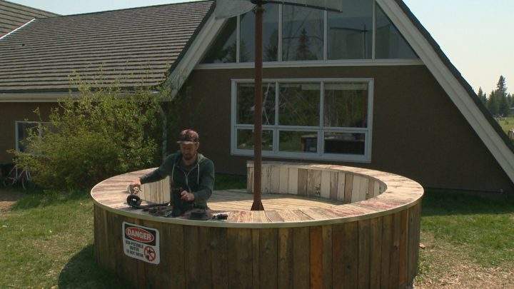 Calgary artist Lane Shordee works on his piece “Water Spiral” at the Wildwood Community Association.
