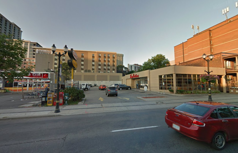 Police say an altercation led to a man firing his gun into a Tim Hortons in downtown Hamilton on Sunday evening.